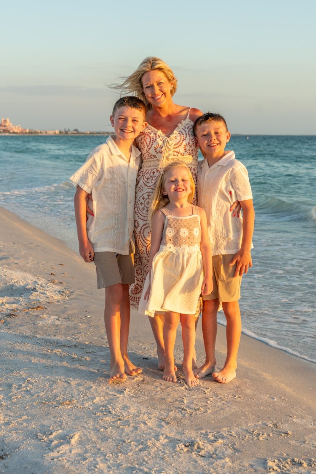 A family together at golden hour on the beach